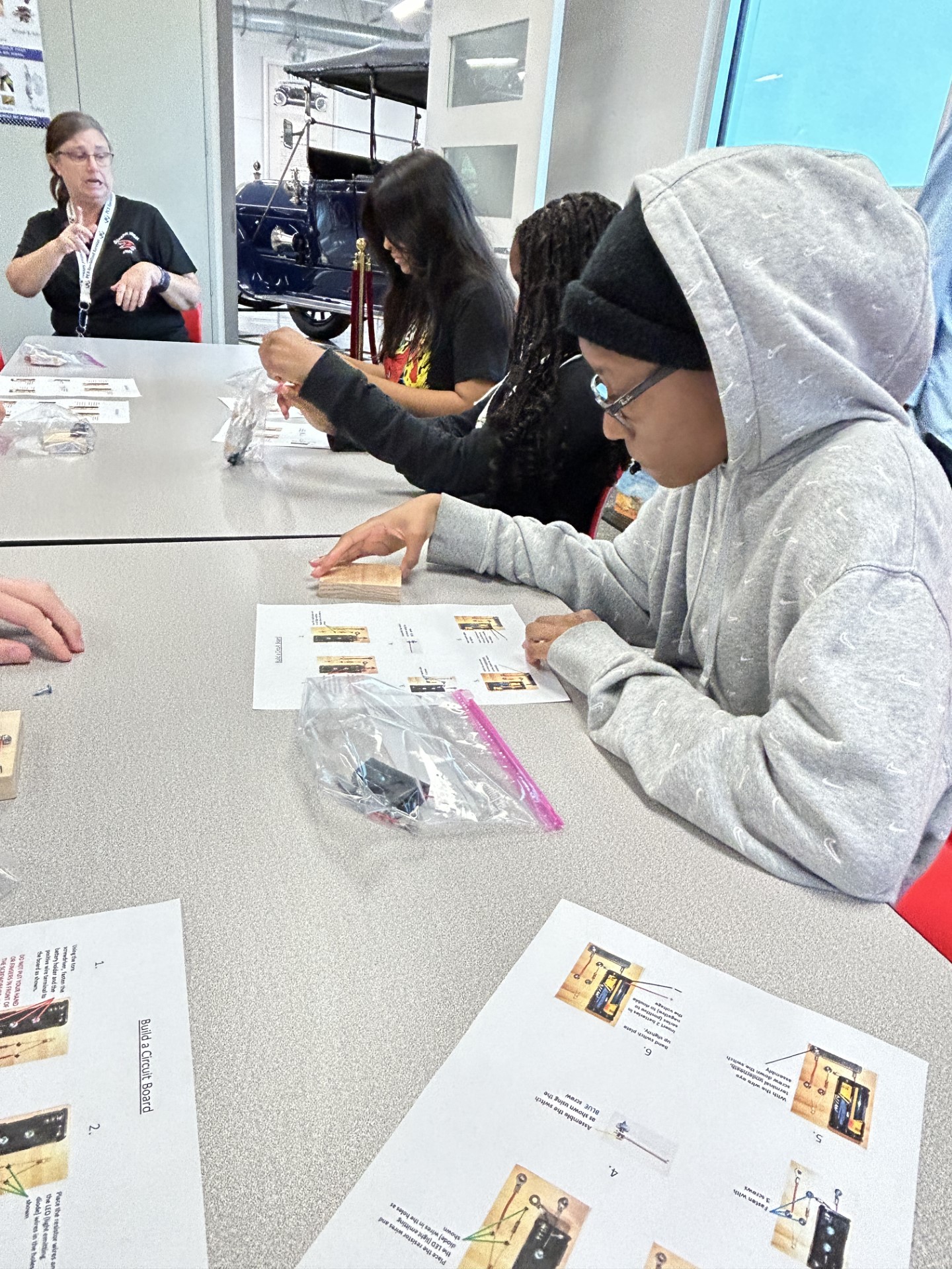 A group of people sitting at a tableDescription automatically generated